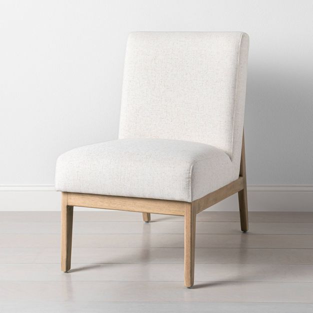 Simple upholstered slipper accent chair.