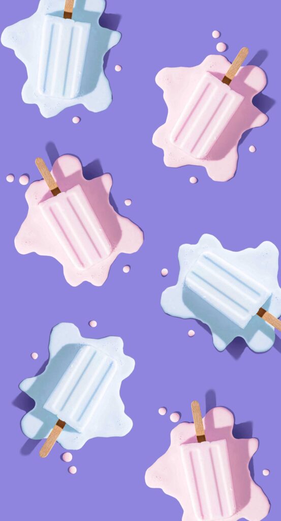 Free phone wallpaper image of melting popsicles scattered on a purple background.