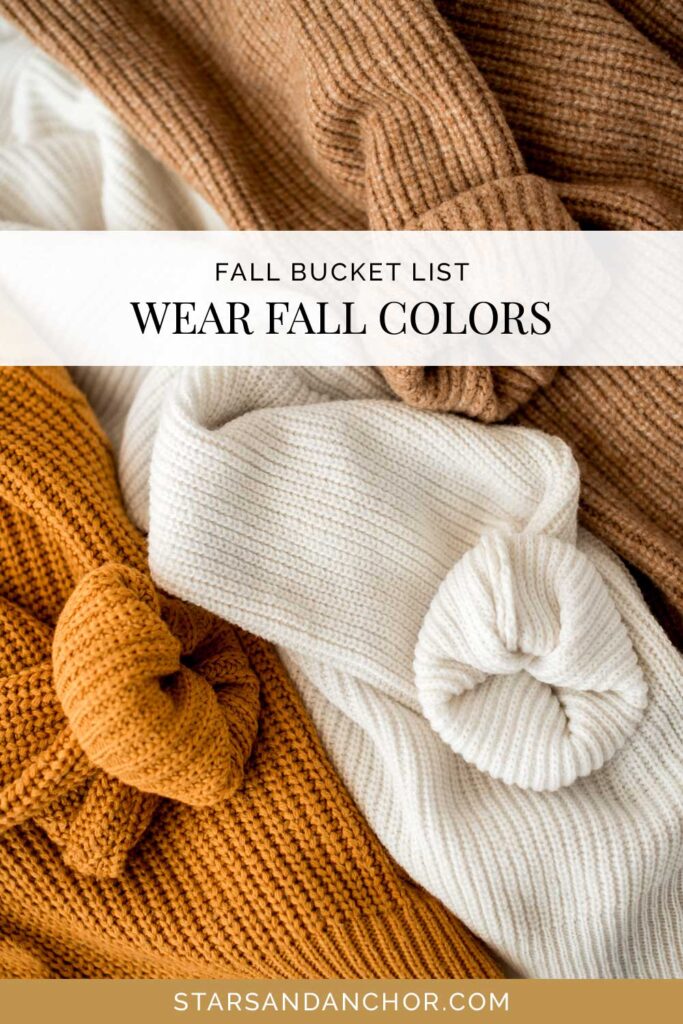 Three sweaters in the colors ochre, cream, and brown, with text that says, "fall bucket list: wear fall colors."