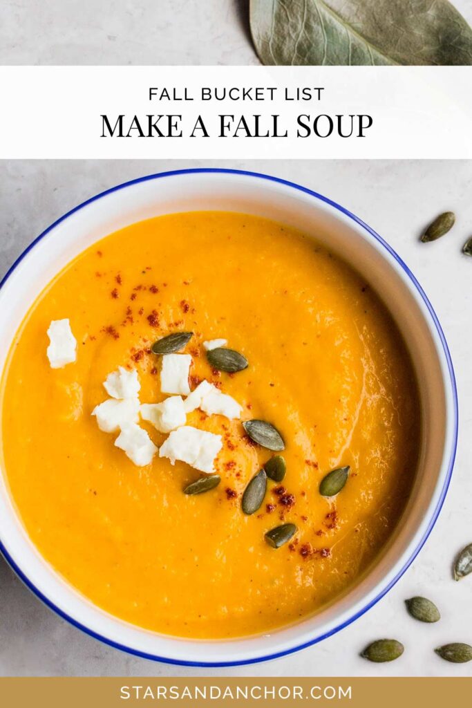 A bowl of butternut squash soup on a table, with text that says, "fall bucket list: make a fall soup."