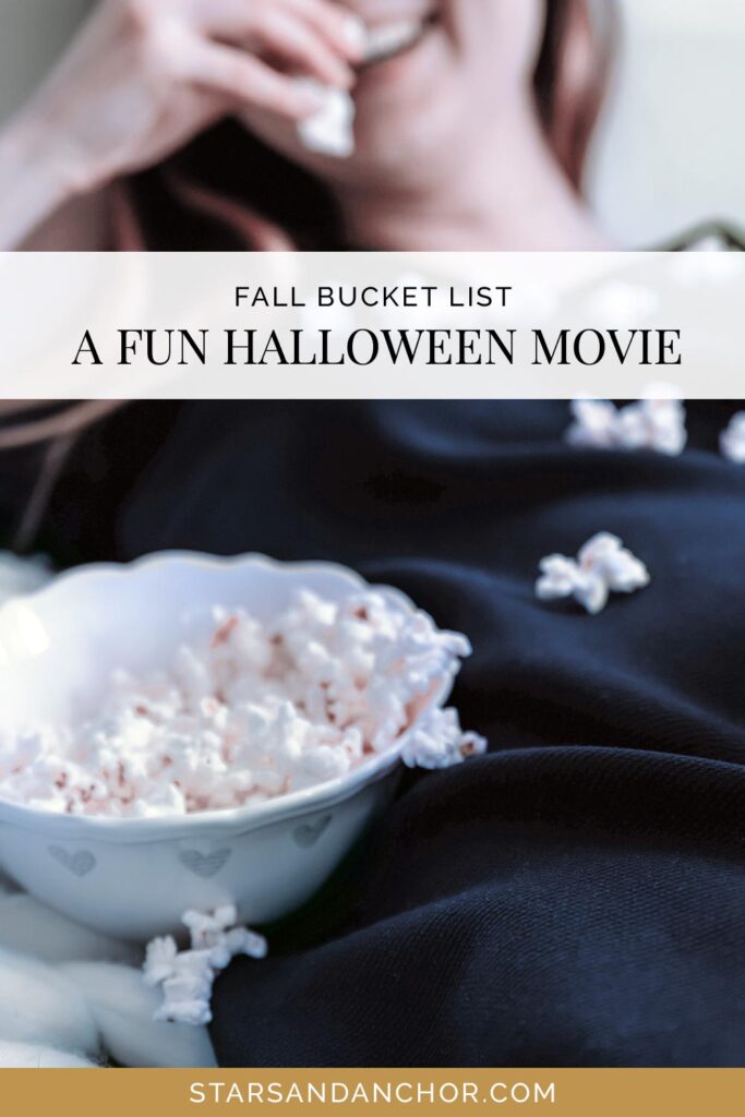 A woman eating popcorn and a bowl of popcorn, with text that says, "fall bucket list: a fun halloween movie."