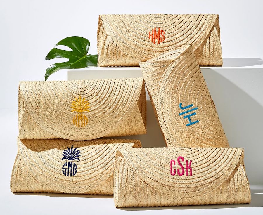 Woven clutch purses with various styles and colors of monograms.