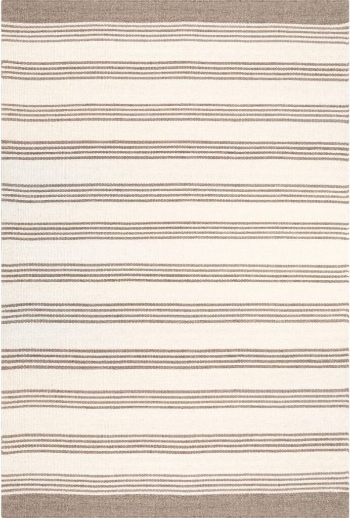 An overhead view of a cream and tan striped area rug.