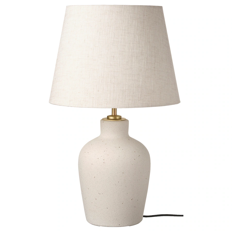 Off-white ceramic table lamp with shade.