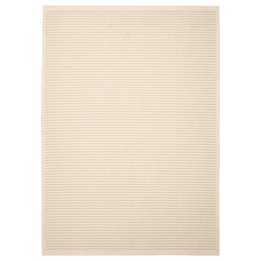 An off-white rug with light green stitching.