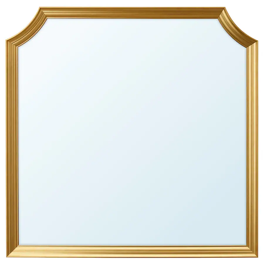 A gold mirror with two scalloped corners.