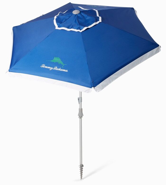 A blue beach umbrella that says Tommy Bahama on it.