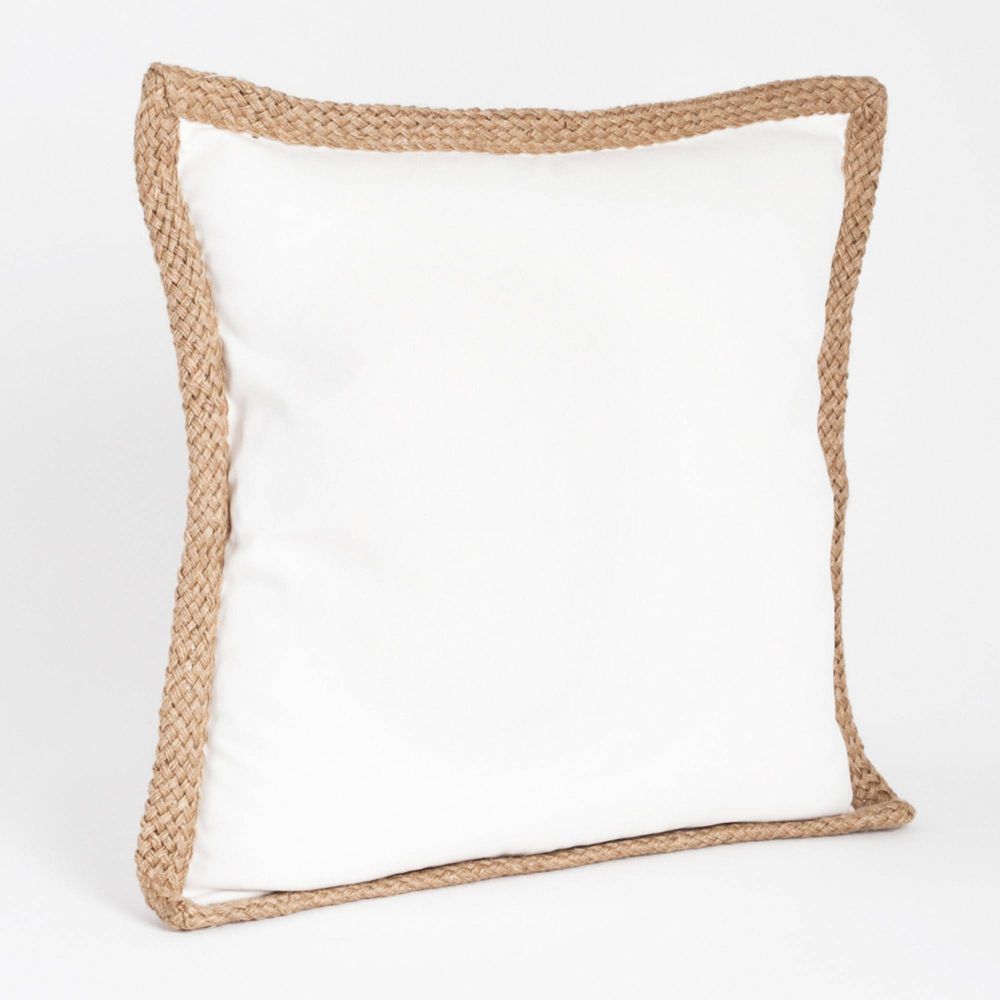 A white throw pillow with a natural braided jute border.