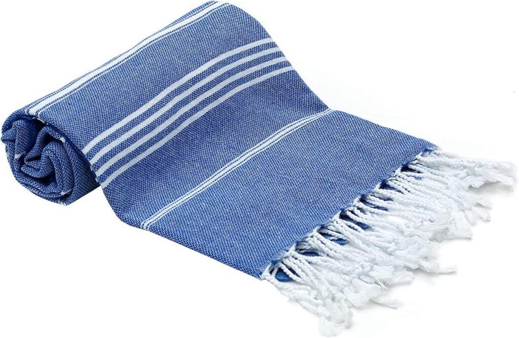 A blue and white striped Turkish beach towel.