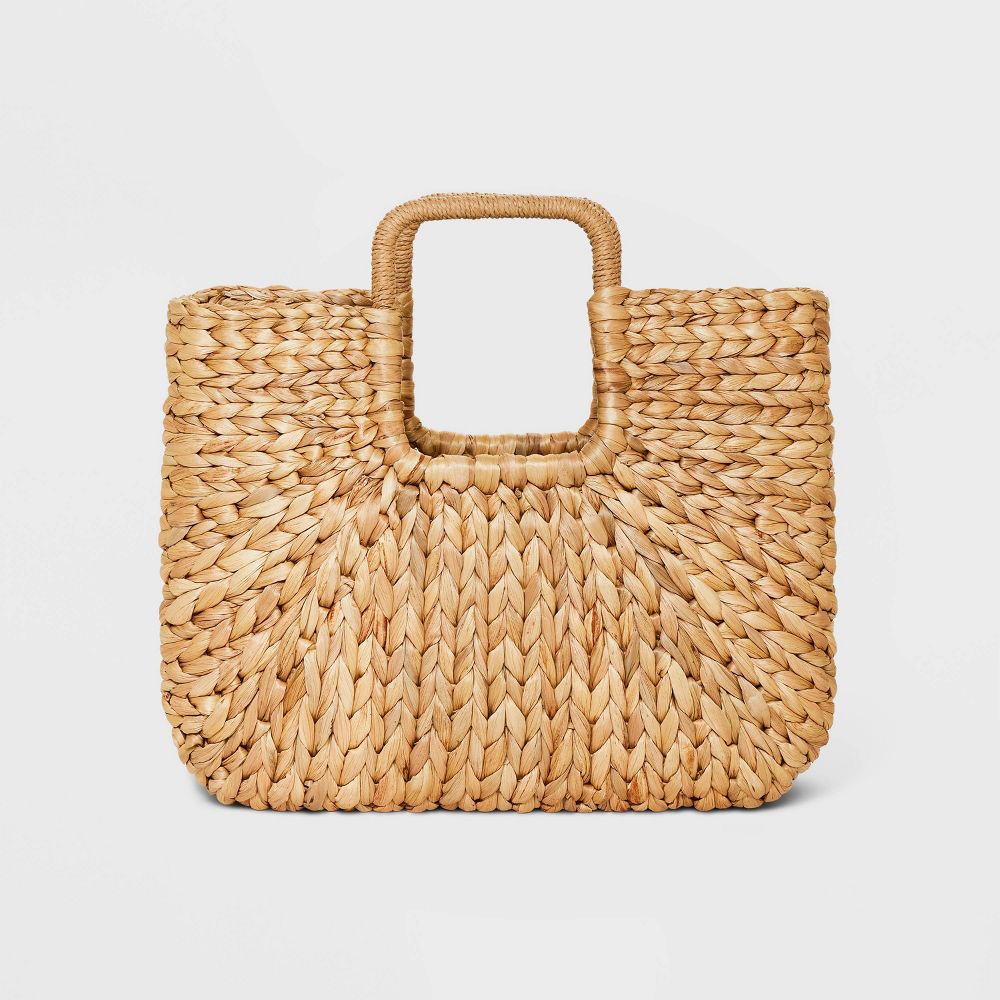 A rectangular structured woven straw tote bag.