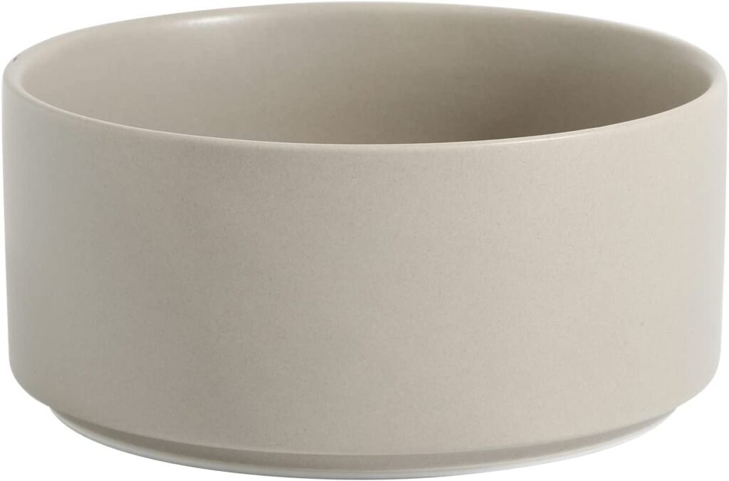 A grey-beige ceramic dog bowl.