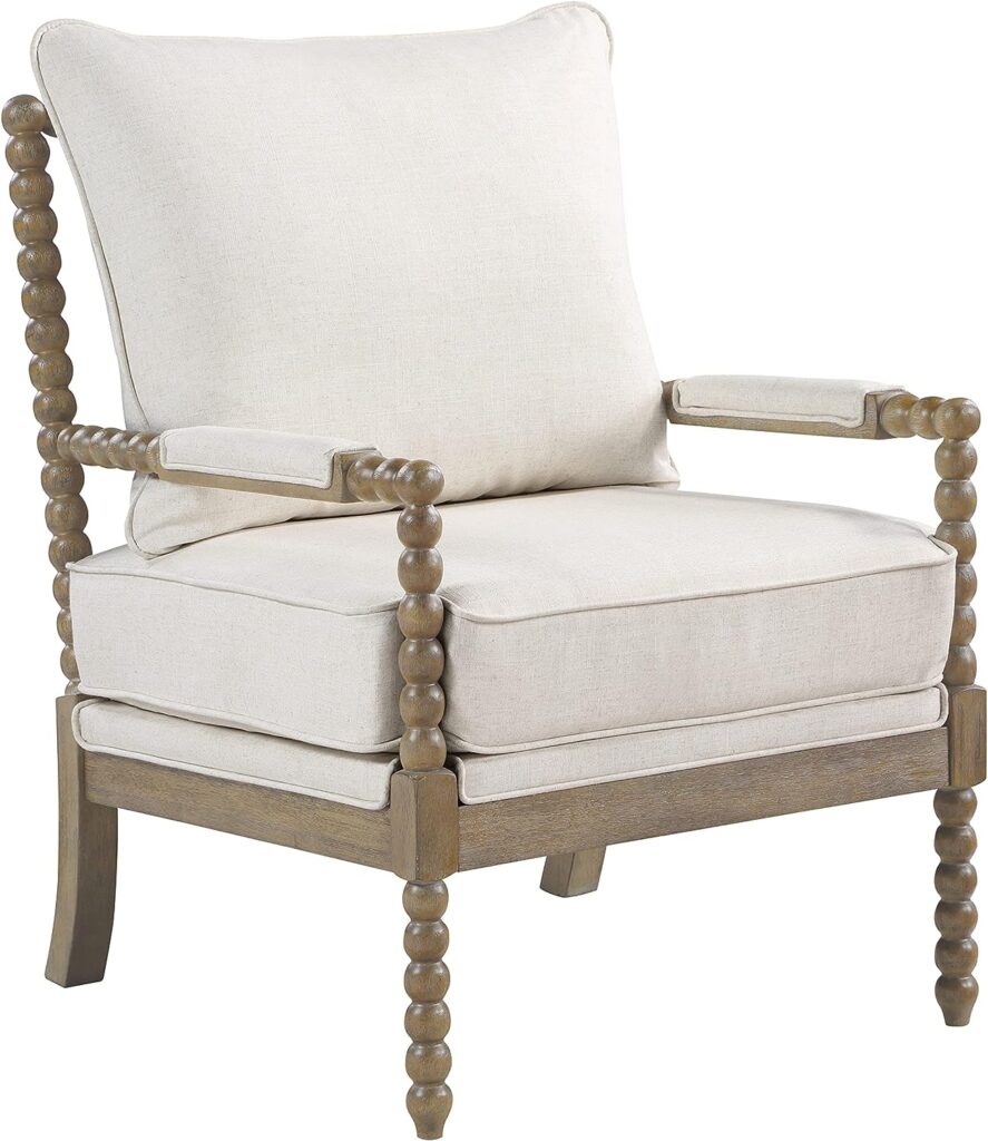 A light brown spindle accent chair with beige cushions.