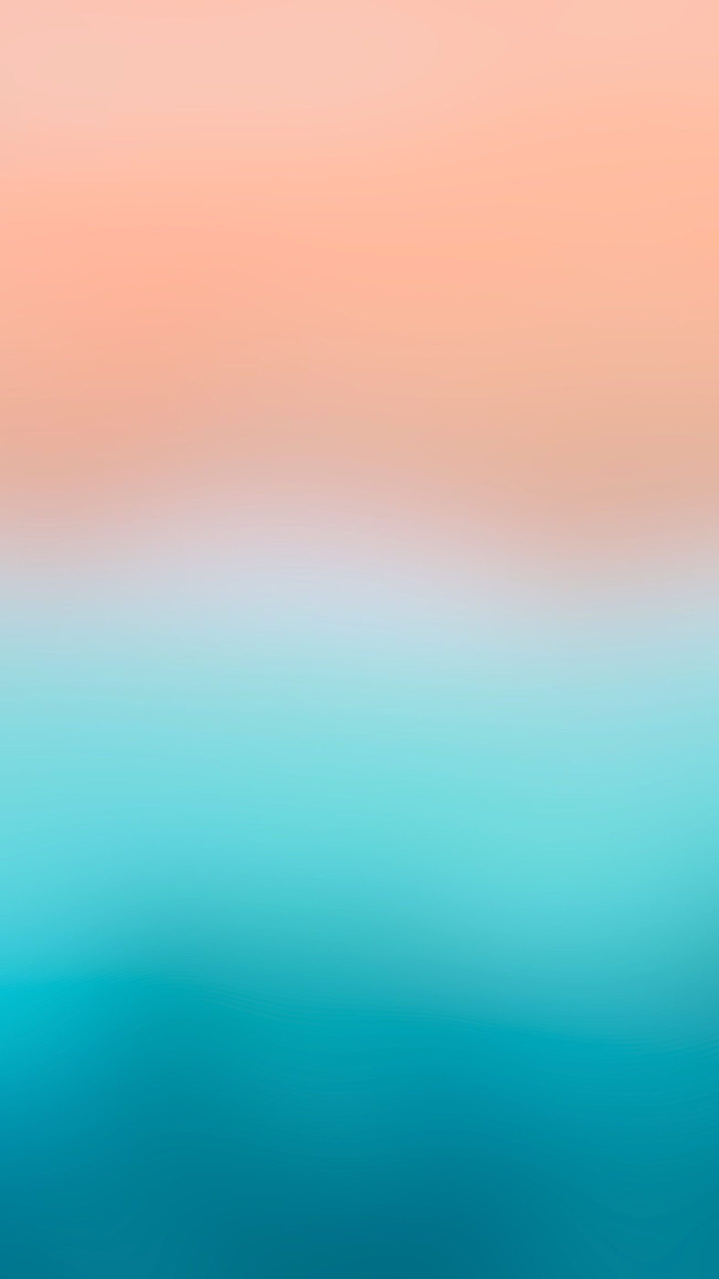 An abstract beach phone wallpaper photograph blending turquoise water and sand.