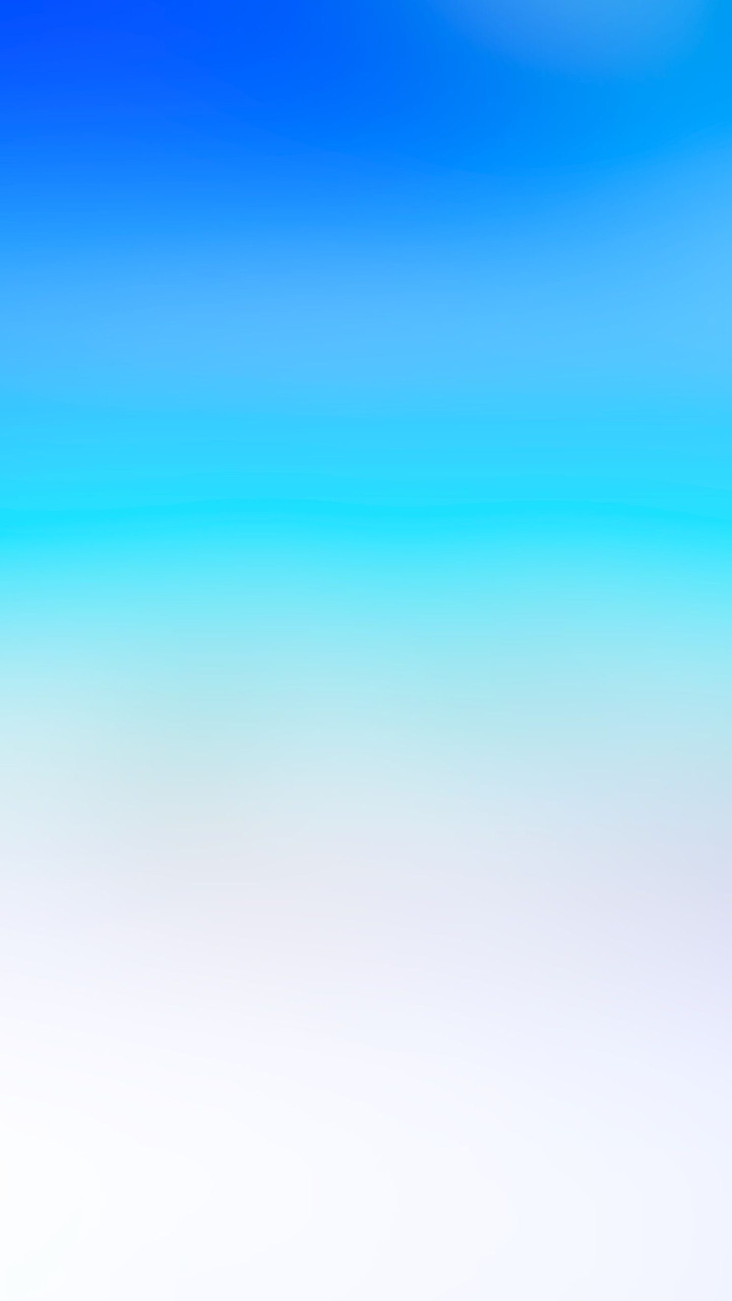 An abstract beach phone wallpaper photograph blending a blue sky, turquoise water and white sand.