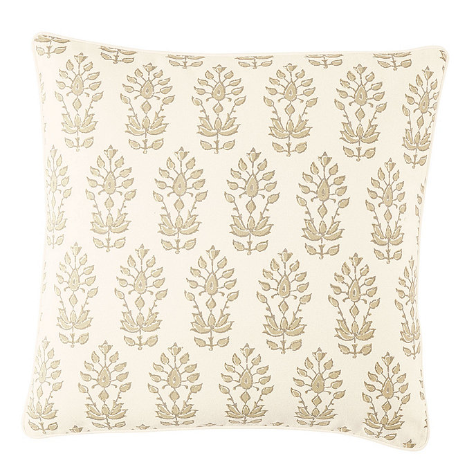 An off-white and beige/taupe throw pillow with a floral block print pattern.