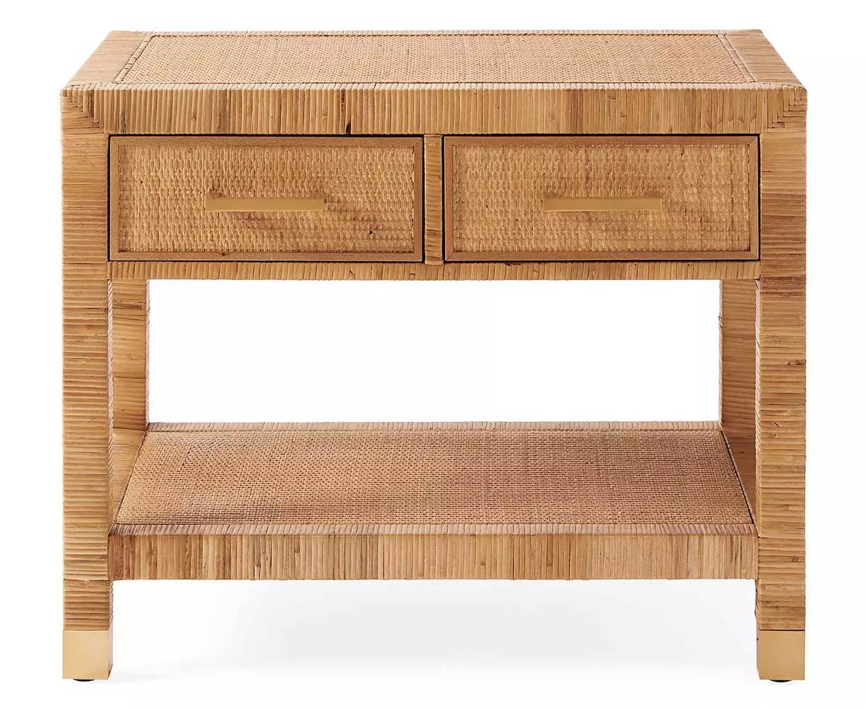 A rattan coastal nightstand with two top drawers and a lower shelf.