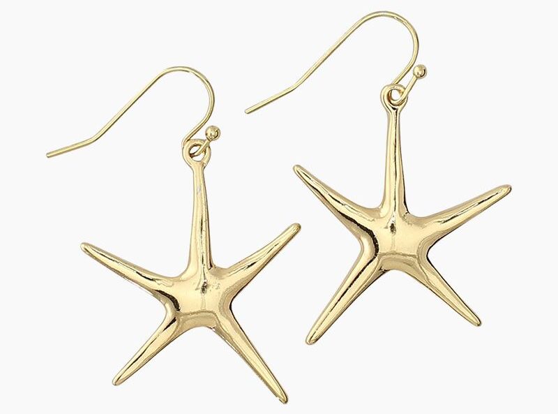 A pair of gold starfish earrings.