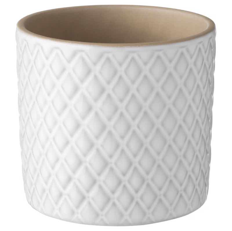 A white stoneware plant pot with a diamond pattern.