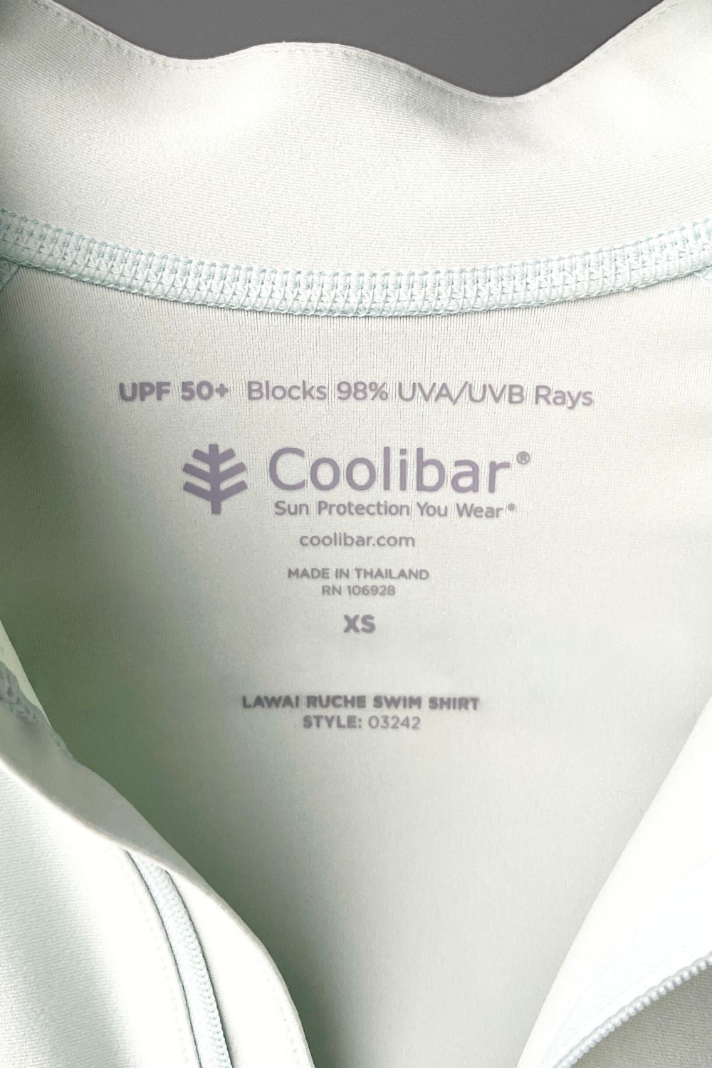 The inside label of a Coolibar UPF 50+ shirt.