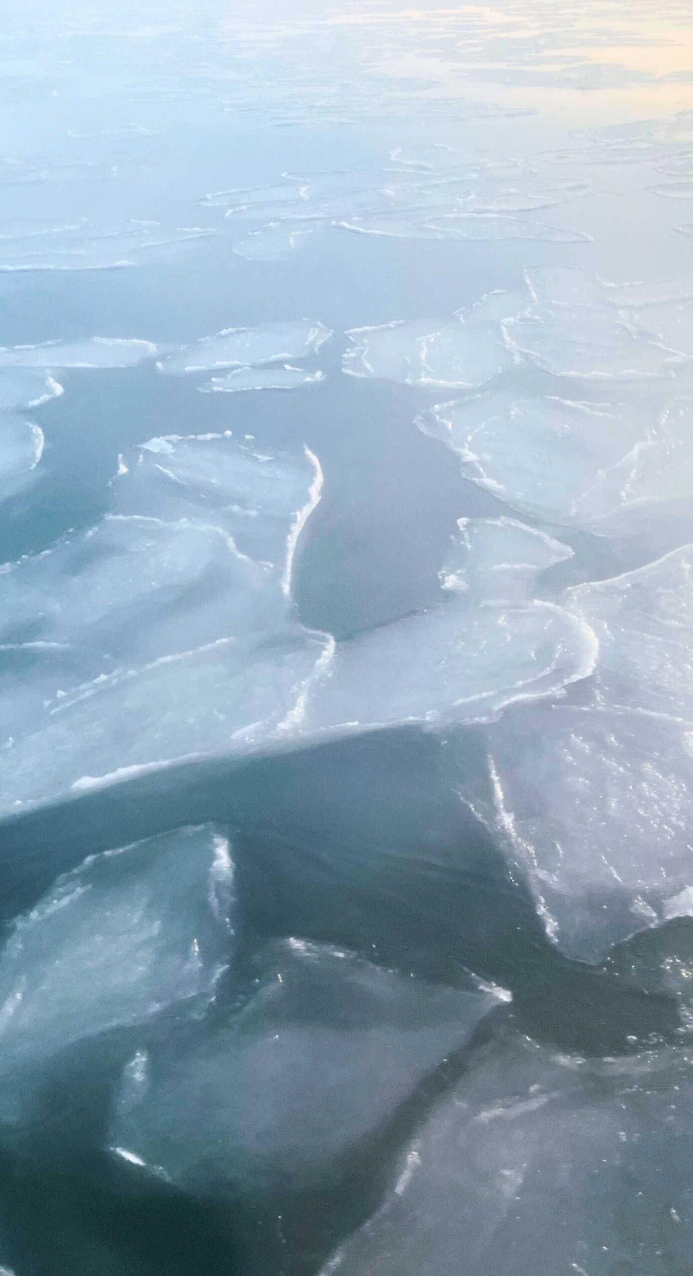 Patches of ice on the water's surface.