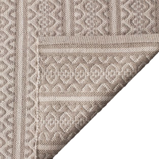 Detail of patterned neutral area rug.