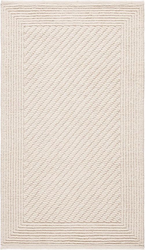 An ivory rug with a woven rectangle border and diagonal inset pattern.