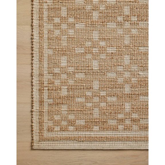 Detail of woven jute blend rug with a graphic pattern.