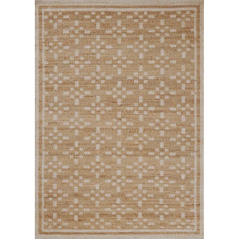 A woven jute blend rug with a graphic pattern.