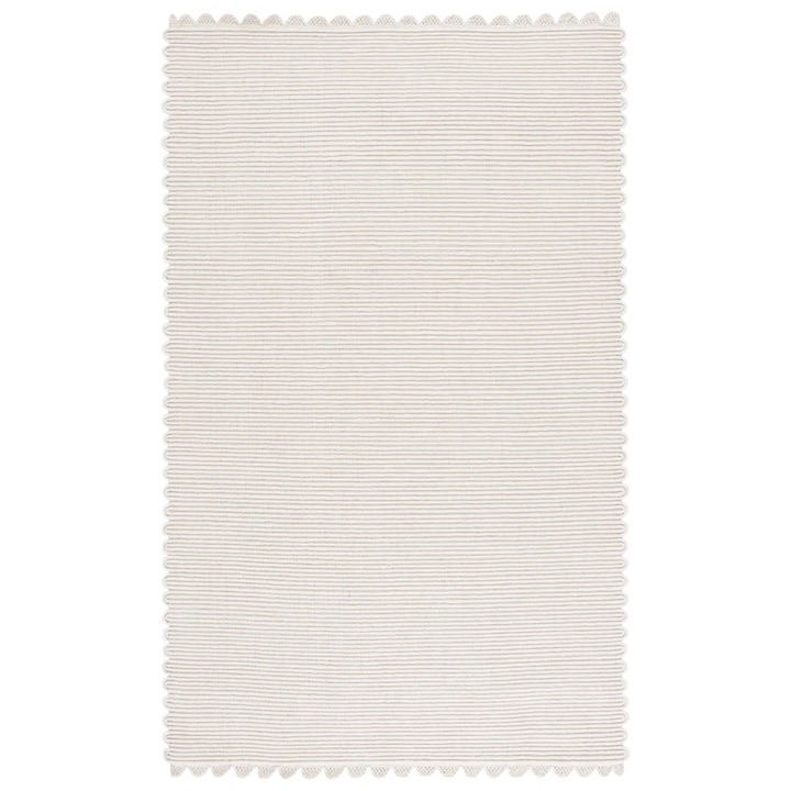 An ivory scalloped rug with a subtle stripe pattern.
