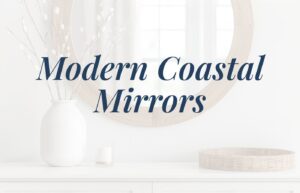 An image of a console table with a round mirror above it. On the console table is a vase holding stems and a rattan tray. There is a text overlay that says: Modern Coastal Mirrors.