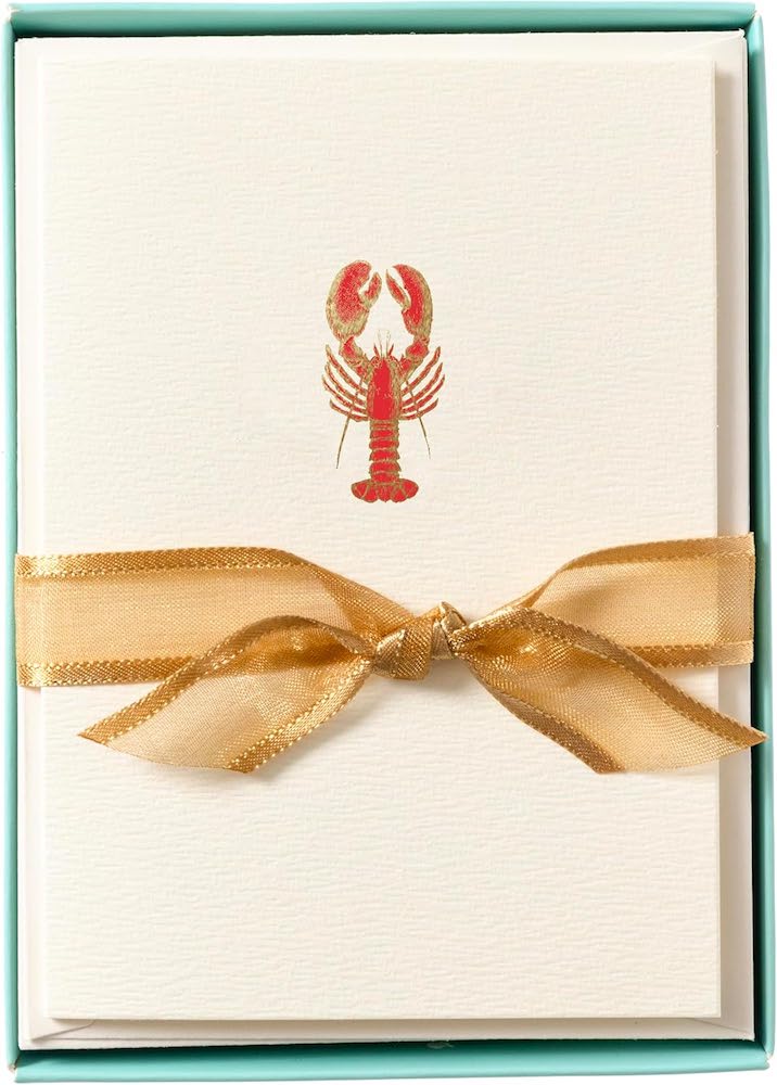 A boxed set of note cards with a red and gold lobster on the front.