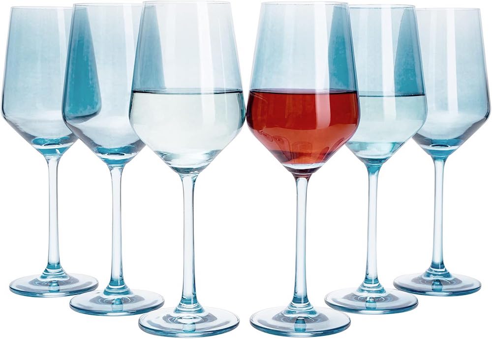 A set of six blue transparent wine glasses.