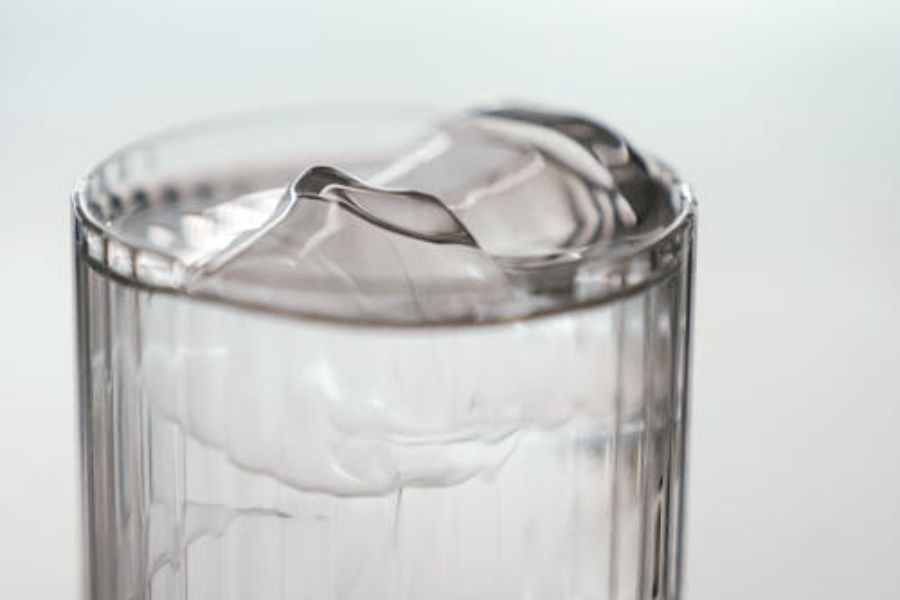 A close up of a glass of ice water.