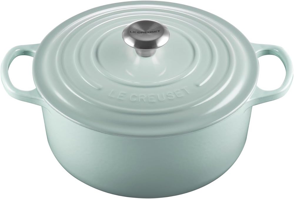 A sea green Le Creuset Dutch oven.