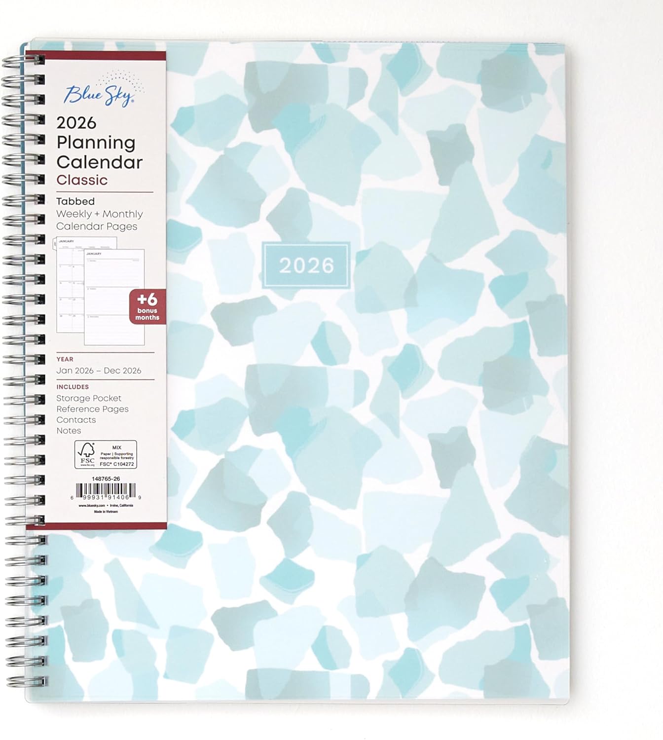 A white 2026 planner with abstract blue and sea green shapes.