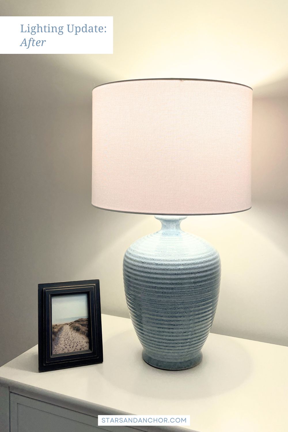 A table lamp demonstrating the light from warm light bulbs. Text on the image says, Lighting Update: After.