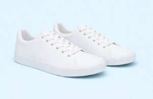 A white pair of women's sneakers.