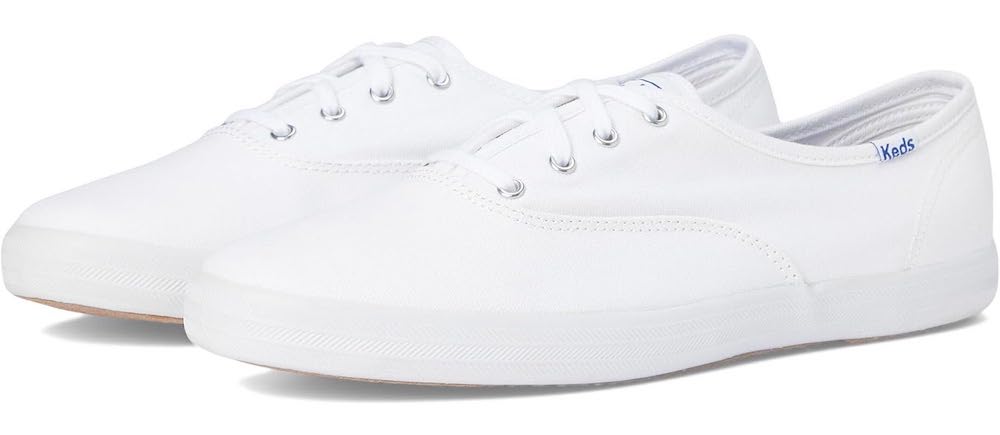 A white pair of Keds sneakers.
