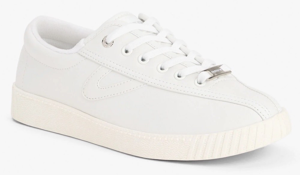 A white pair of Tretorn sneakers.
