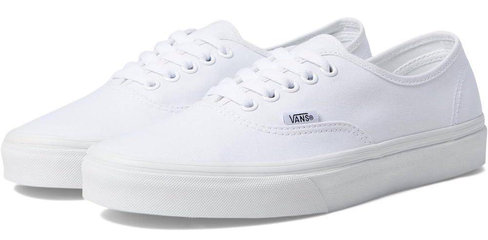 A white pair of women's Vans sneakers.