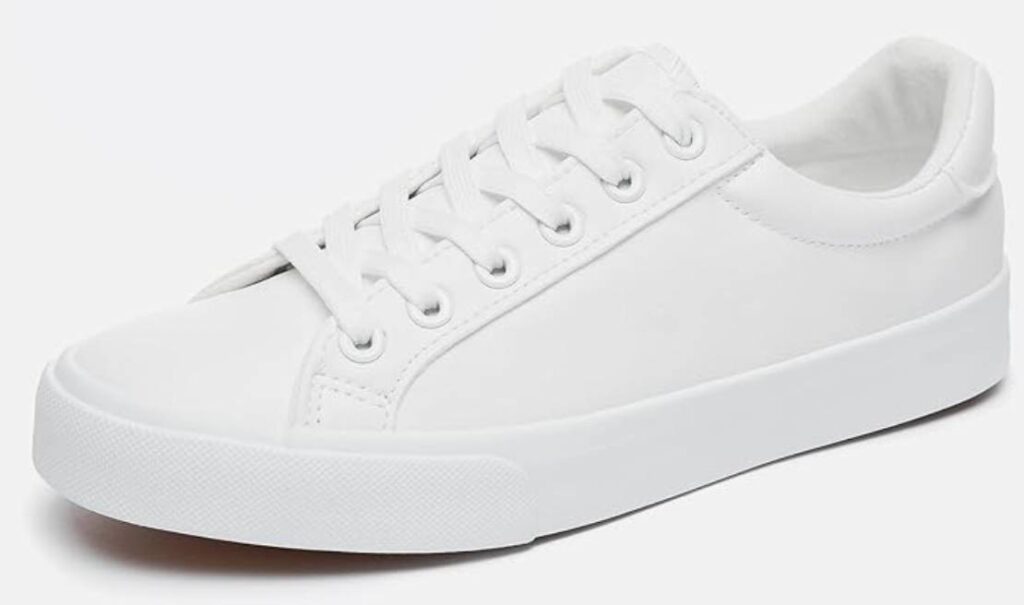 A white pair of women's faux leather sneakers.
