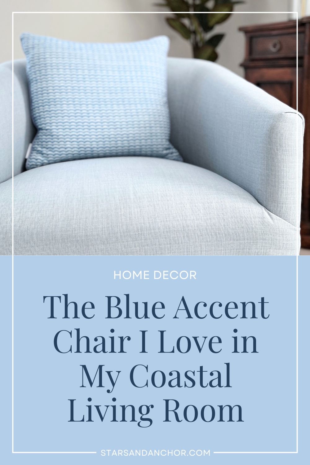 A blue accent chair with an accent pillow, and text over it that says, Home Decor: The Blue Accent Chair I Love in My Coastal Living Room.