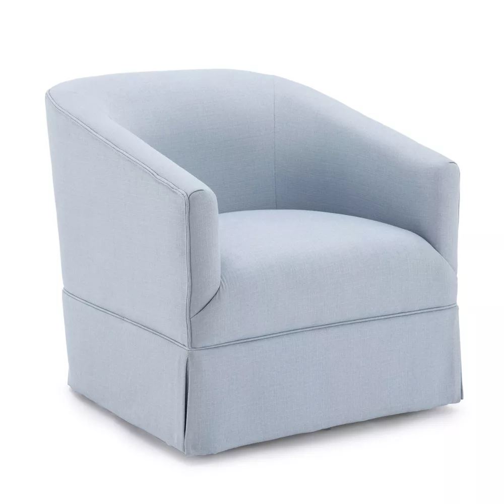 A blue skirted accent chair.