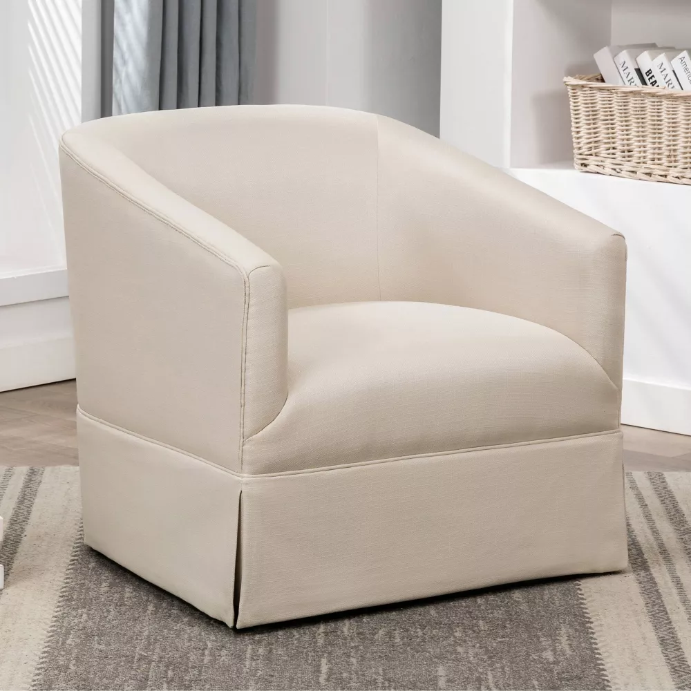 An ivory skirted accent chair.