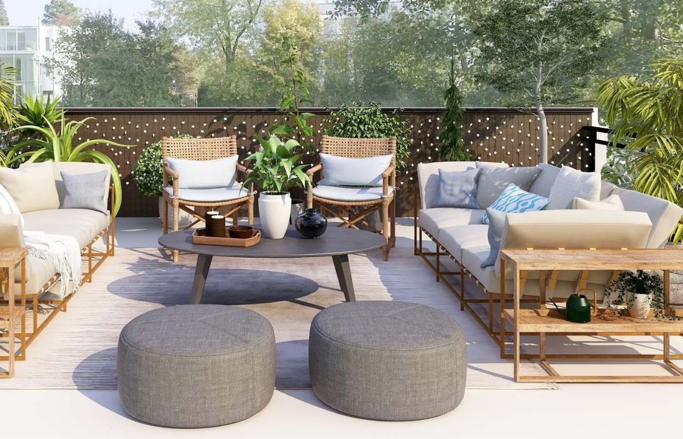 An outdoor patio with couches, chairs, tables, and plants, and a privacy wall.