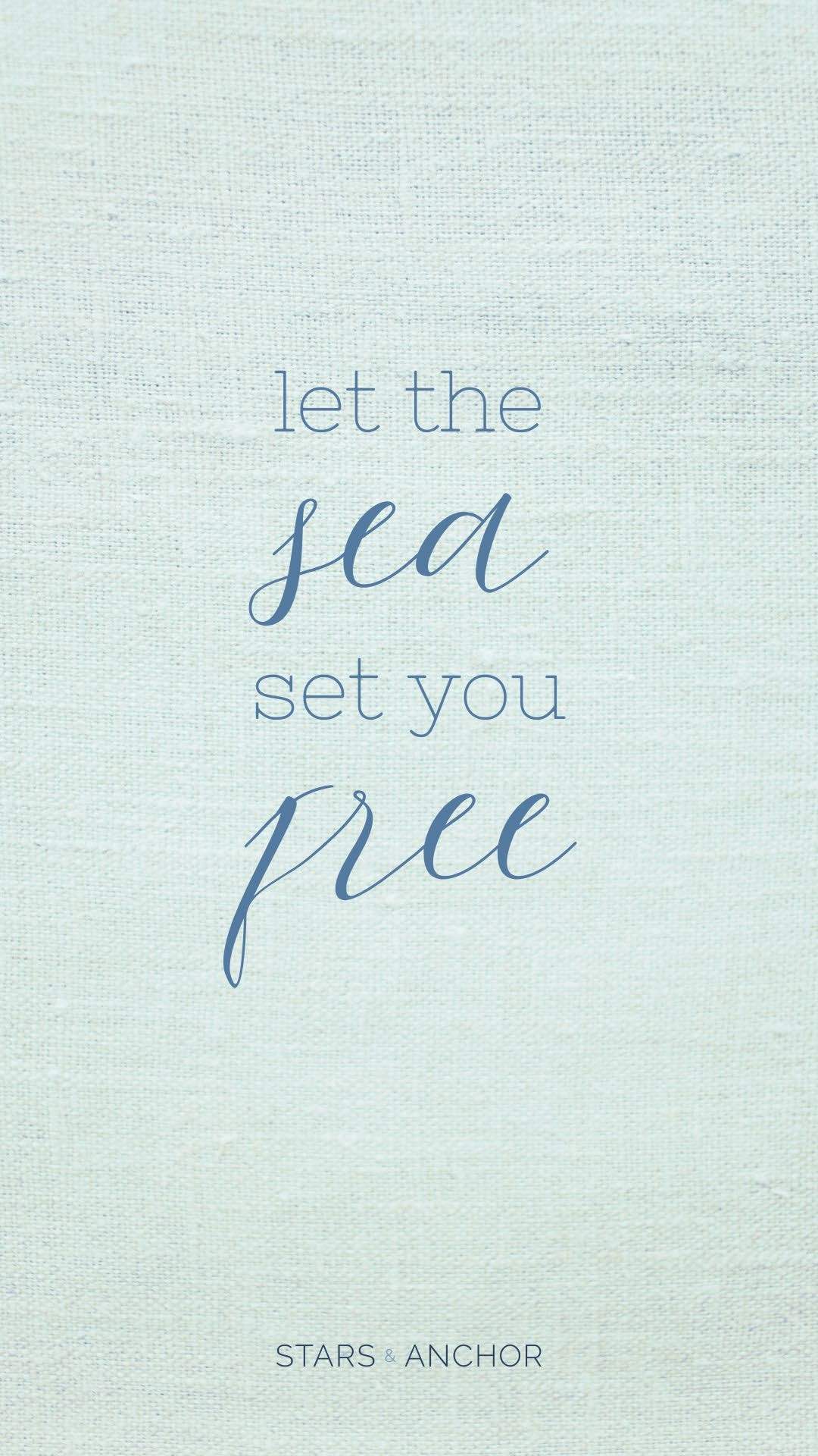 A textured linen background with the text "let the sea set you free"