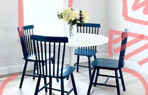 A kitchen dining area with design plans drawn over it.