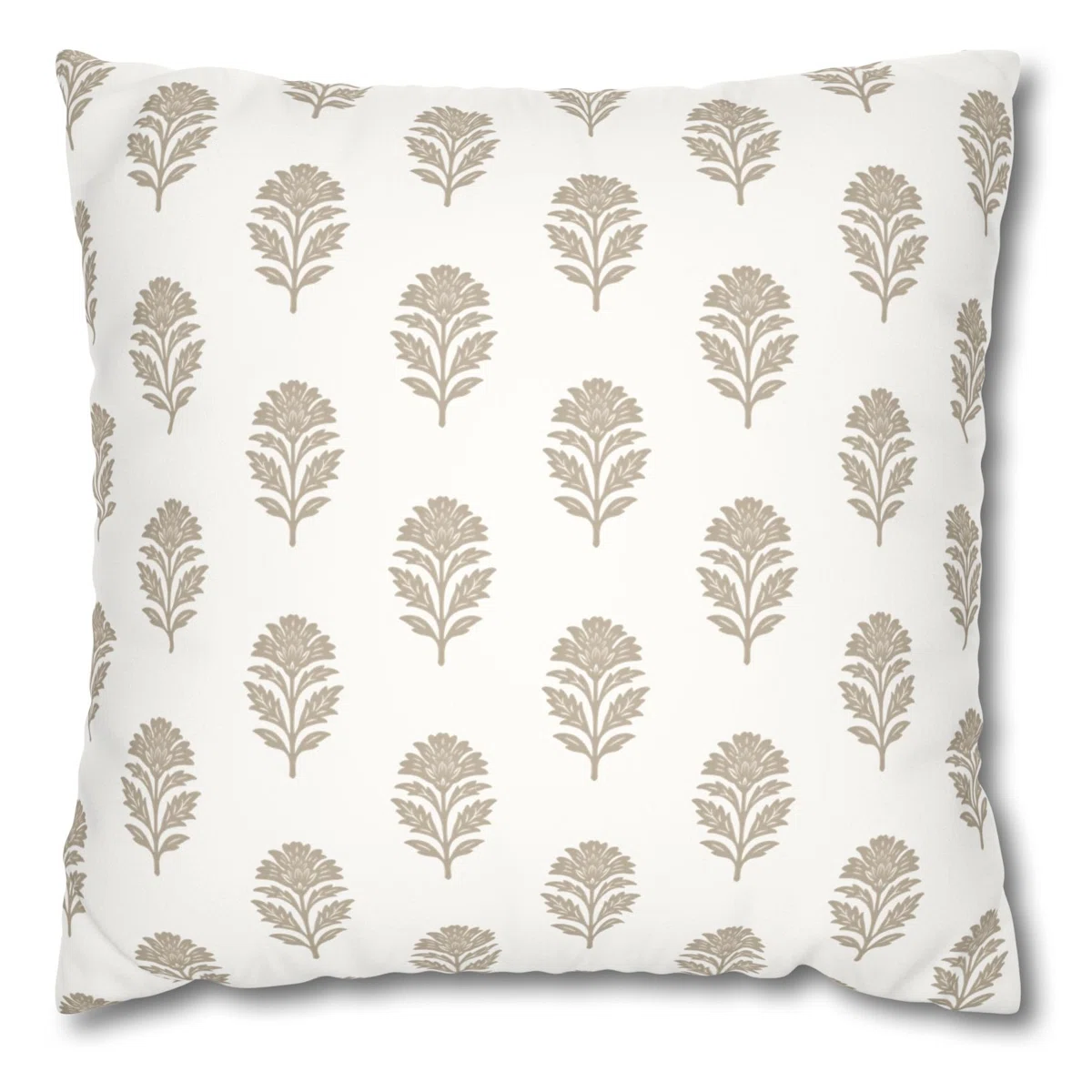 A block print inspired floral pillow in white and tan.